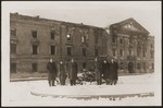 Meir Yaari, head of the MAPAM political party in Palestine, visits the ruins of the Judenrat building in the former Warsaw ghetto.