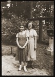 Two Jewish girlfriends pose in a park in Bialystok.