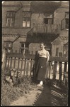 Haika Grosman poses in front of the home of her friend and future husband, Meir Orkin, in Bialystok.