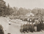 German civilians attend funeral services conducted by the pastor of Schwarzenfeld for the 140 Polish, Russian, and Hungarian Jews exhumed from a mass grave near the town.