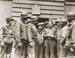 American Army chaplain Rabbi Samuel Blinder converses with a group of Jewish soldiers outside a synagogue in Germany.