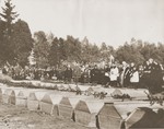 German civilians attend funeral services conducted by the pastor of Schwarzenfeld for the 140 Russian, Hungarian, and Polish Jews exhumed from a mass grave near the town.