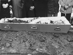 The body of Lt. Aleksander Pechersky lies in an open coffin during his funeral.