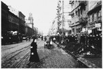Jews walk along a crowded street in the Warsaw ghetto.