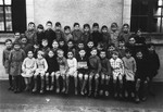 Group portrait of an elementary school class in Buzancais, France that included a Jewish child in hiding.