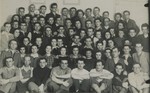 Group portrait of members of an Akiva Zionist youth hachshara [agricultural collective] that had moved to Vilna after the German occupation of Poland.