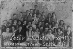Group portrait of young forced laborers at the leather and saddle-making workshop in the Lodz ghetto.