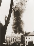 Local residents watch as flames consume the synagogue in Opava, set on fire during Kristallnacht.
