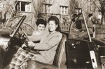 Two Jewish DP women sit in an automobile at the Fuerth displaced persons camp.
