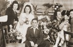 A Jewish DP bride sits among friends during her wedding celebration in Fuerth, Germany.