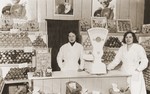 Storekeepers in the Valencia-Garten, a gourmet store on the Neue Friedrichstrasse in Berlin, owned by the donor's aunt, Gitta Schadur, a Jewish emigre from Riga.