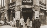 Bernhard and Sonja Schadur Goldstein pose with some of their employees in front of their fruit business in Berlin.
