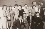 Group portrait of Jewish DP survivors from Brody, Poland at a reunion in the Foehrenwald displaced persons camp on the first day of the Jewish holiday of Sukkoth, 1946.