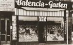 Exterior view of the Valencia-Garten, a gourmet shop on the Neue Friedrichstrasse in Berlin, owned by the donor's aunt, Gitta Schadur, a Jewish emigre from Riga.