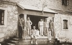 Jewish workers pose on the porch of a mill in Lyubcha.