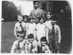 Otto Pushner (at rear) with a group of Scottish children at The Priory, a children's holiday home originally designated  for Edinburgh youngsters who had experienced abuse or stressful home circumstances.