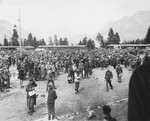 A crowd of survivors gathers in the main square of the newly liberated Ebensee concentration camp.
