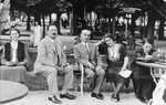 Members of the Klein/Kupfermann family sit in a park at a vacation resort in Croatia.