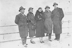 Group portrait of Jewish couples from the Balkans on board a ship during a sightseeing excursion to Palestine.