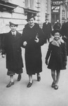 A Jewish family from Yugoslavia walks along a commercial street in Bucharest.