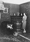 Olga Fuchel relaxes with her dogs in the Vienna apartment she shared with her husband, Rudolf.