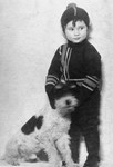 Liane Reif poses in winter clothes, standing next to her dog.