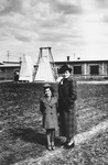 Blanka and Marta Kupfermann pose on the grounds of the wood processing plant built by Beno Kupfermann in Gugesti, Romania.