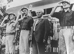 David Ben-Gurion, the Prime Minister of Israel, inspects troops in Tel Aviv along with General Yigal Allon (far left) and General Yigal Yadin (second from the left).