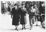 Three Jewish women walk along a commercial street in Sarajevo.