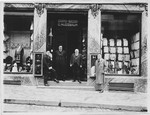 Gustave Nussbaum poses with others in front of his clothing store, Grand-Bazar G.