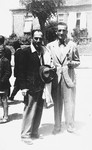 Majer Altarac, (left), a Jewish refugee from Belgrade, poses outside with David Amarilio, a Macedonian Jew who has given him and his family lodging in Bulgarian-occupied Skopje.