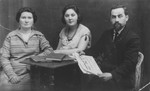 Studio portrait of the Ajzner family.

Pictured from left to right are Chaja Ester, Malka Bella and Noah Ajzner.