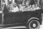 The Berkowicz and Eisenberg families go for a car ride while on vacation in Druskieniki, Poland.