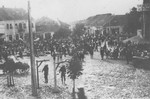 Two Serbian partisans executed by German soldiers hang from a gallows in the town square of Kraljevo.