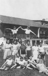 A group of children pose outdoors at a school for Jewish DPs in Munich.