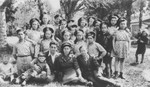 Shmuel Rakowski (front row, third from the right) poses with a group of children he will escort to Palestine on the SS Champollion.