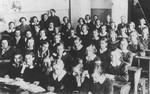 Seventh grade students and teachers pose in their classroom at the public school on Narutowicza Street in Dabrowa Gornicza.