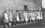 Girls are assembled for roll call at the Jugend- schutzlager Litzmannstadt, a concentration camp for Polish juveniles.