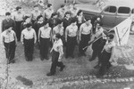 Members of the hachshara [Zionist collective] Kibbutz Hathiya stand in formation during a procession at the Foehrenwald displaced persons camp.
