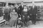 Members of the Rakowski and Banach families pose in their lumberyard in Kazimierza Wielka.