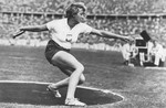 Polish athlete Jadwiga Wajsowna competes in the discus throwing event at the 11th Summer Olympic Games in Berlin.