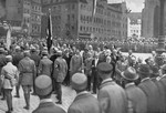 Adolf Hitler, Julius Streicher and other dignitaries review passing Nazi Party members at the Deutscher Tag [German Day] celebration in Nuremberg.