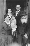 A Jewish family poses for a family photograph outside its home on the eve of Shavuot.