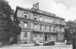 Exterior view of a swastika flag flying over the Brown House, the Nazi party headquarters, in Munich.