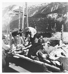 German civilians remove the bodies of former prisoners at the Ebensee concentration camp.