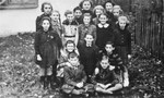 Group portrait of pupils attending a clandestine school in the Mielec ghetto.