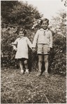 The two youngest members of a group of children that was released from the Rivesaltes internment camp, pose on the grounds of the Chateau Montluel children's home near Lyon.