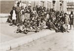 A group of Jewish children released from the Rivesaltes internment camp, wait at the Narbonne railway station for transport to the Chateau Montluel children's home near Lyon.