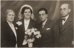 Oskar and Berta (Gottfried) Fiedler pose with their parents at their wedding in Vienna.