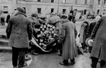 A wreath is laid at a memorial site in Warsaw for those killed during the Warsaw ghetto uprising [probably during a ceremony marking the fourth anniversary of the Warsaw ghetto uprising].